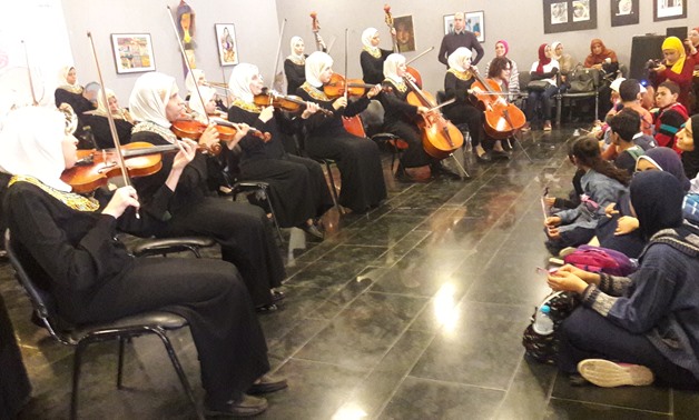 Orchestra Al Nour Wal Amal performing at “Music: Hope & Life” as audiences with different abilities watch