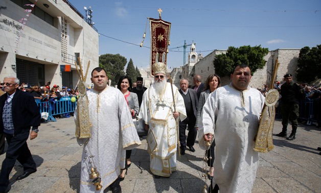 Christian Orthodox worshippers during the ceremony of the "Holy Fire" in Jerusalem - AFP