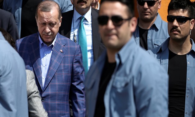 Erdogan leaves a polling station in the Uskudar district in Istanbul - REUTERS