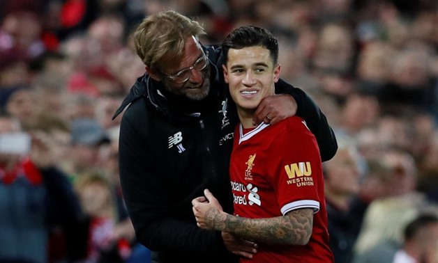 Soccer Football - Premier League - Liverpool vs Southampton - Anfield, Liverpool, Britain - November 18, 2017 Liverpool's Philippe Coutinho celebrates with manager Juergen Klopp after scoring their third goal Action Images via Reuters/Jason Cairnduff 