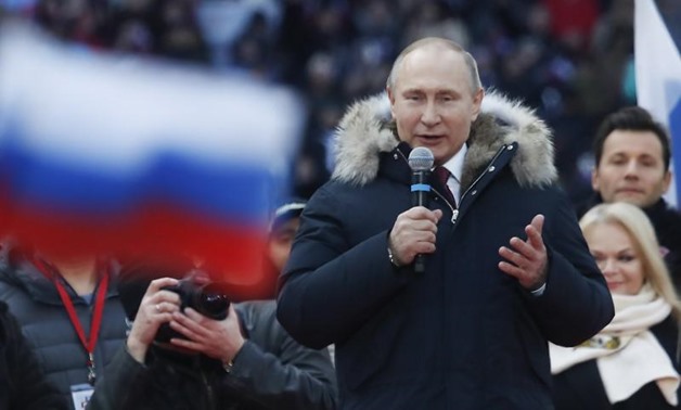 Russian President Vladimir Putin delivers a speech during a rally to support his bid in the upcoming presidential election at Luzhniki Stadium in Moscow, Russia March 3, 2018. REUTERS/Maxim Shemetov