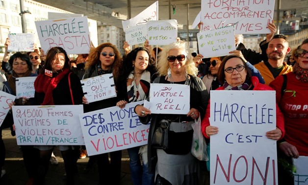 Women hold placards during a gathering against gender-based and sexual violence in Marseille, France, October 29, 2017. REUTERS/Jean-Paul Pelissier