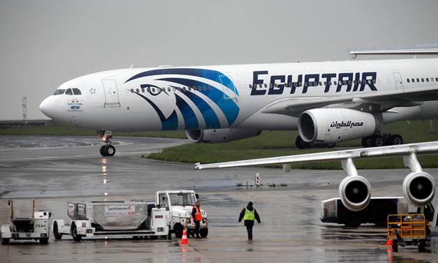 The EgyptAir plane scheduled to make the following flight from Paris to Cairo, after flight MS804 disappeared from radar, taxies on the tarmac at Charles de Gaulle airport in Paris – AFP/Thomas Samson
