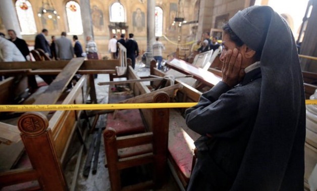 A nun cries as she stands at the scene inside Cairo’s Coptic cathedral, following a bombing, in Egypt December 11, 2016. REUTERS/Amr Abdallah Dalsh