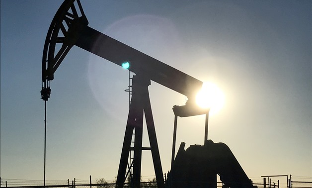 FILE PHOTO: An oil pump is seen operating in the Permian Basin near Midland, Texas, U.S., May 3, 2017. REUTERS/Ernest Scheyder