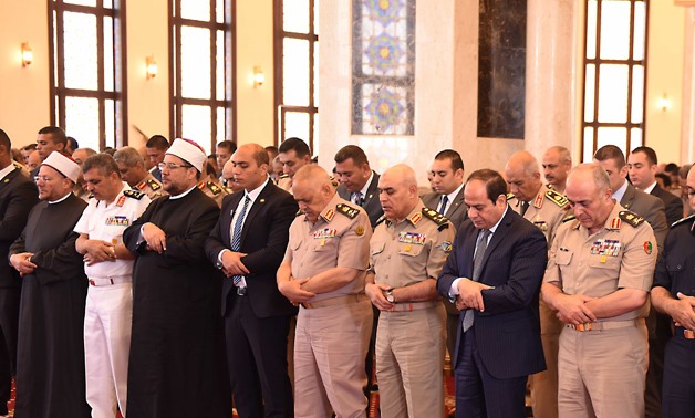 FILE- President Abdel Fatah al-Sisi and a number of military commanders perform Friday prayer in Marshal Tantawy in June 2016, celebrating the 10th of Ramadan, the ninth month of the Islamic calendar when the Egyptian forces defeated Israeli forces in 197
