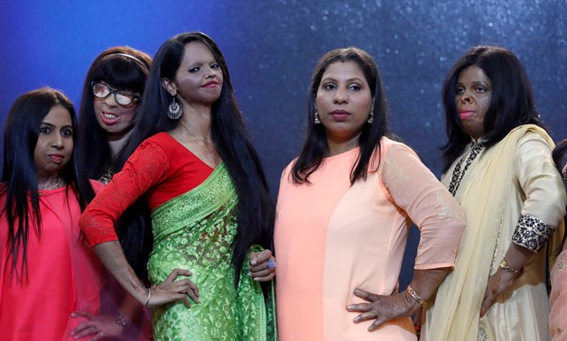 Acid attack survivors pose during a fashion show to mark International Women's Day in Thane on the outskirts of Mumbai, India, March 7, 2018. REUTERS/Danish Siddiqui