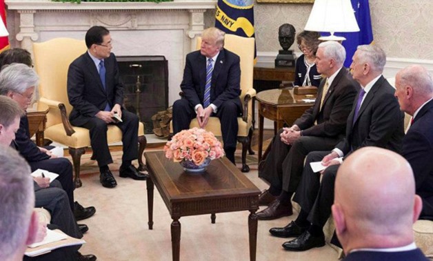 South KoreaÕs national security chief Chung Eui-yong briefs U.S. President Donald Trump at the Oval Office about his visit to North Korea, in Washington March 8, 2018. The Presidential Blue House/Yonhap via
