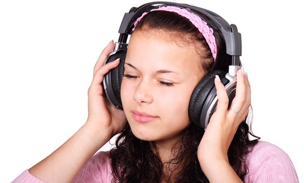 Stock image of a girl listening to music, Undated – Petr Kratochvil/publicdomainpictures