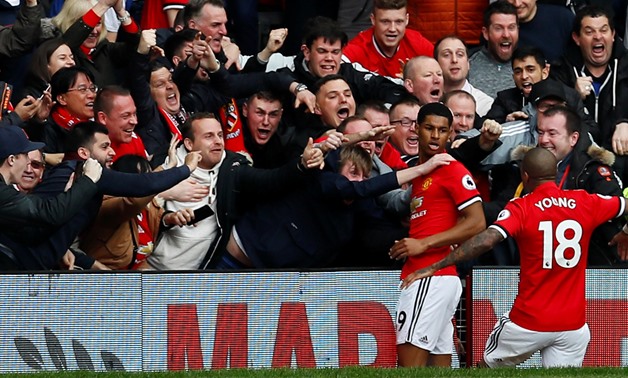 Soccer Football - Premier League - Manchester United vs Liverpool - Old Trafford, Manchester, Britain - March 10, 2018 Manchester United's Marcus Rashford celebrates scoring their first goal with fans Action Images via Reuters/Jason Cairnduff 