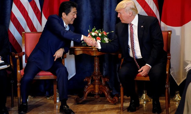 U.S. President Donald Trump (R) and Japan's Prime Minister Shinzo Abe shake hands during a bilateral meeting at the G7 summit in Taormina, Sicily, Italy, May 26, 2017. REUTERS/Jonathan Ernst