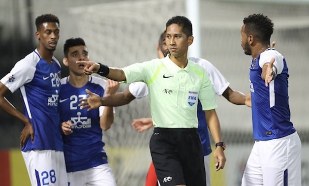 Al Hilal players argure with the referee during the game against Al Rayyan, AFC Champions League Twitter account 