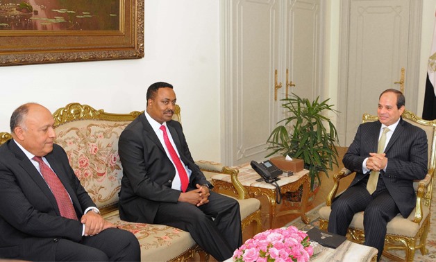 Egyptian President Abdel Fatah al-Sisi (R), Ethiopian Foreign Minister Workneh Gebeyehu  (M) and Egyptian Foreign Minister Sameh Shoukri (L) - Press photo