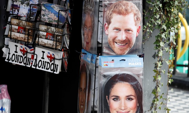 Cardboard facemasks of Britain's Prince Harry and his fiancee Meghan Markle are seen for sale at a kiosk in central London, March 14, 2018. REUTERS/Phil Noble
