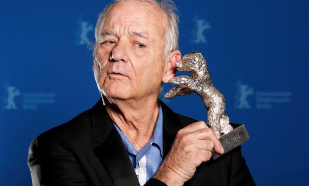 FILE PHOTO: Actor Bill Murray holds the Silver Bear for Best Director award on behalf of Wes Anderson for movie Isle of Dogs during the awards ceremony at the 68th Berlinale International Film Festival in Berlin, Germany, February 24, 2018. REUTERS/Axel S
