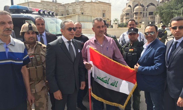 Egyptians in Iraq take memorial photos with Egyptian Ambassador in front of the Egyptian Embassy in Baghdad, where the voting process at the Presidential Election takes place - Press Photo