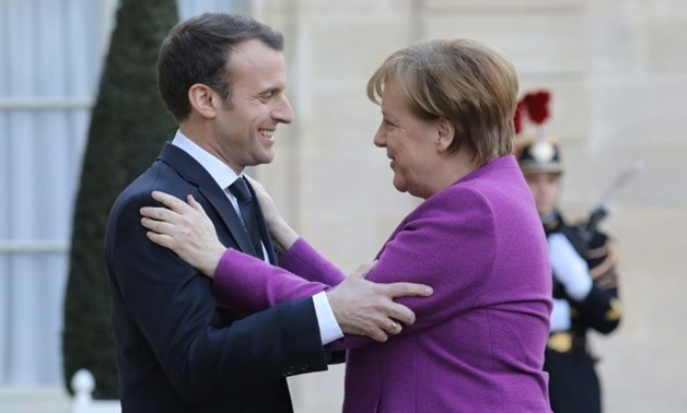Angela Merkel's talks in Paris with Emmanuel Macron drew a sharp response from Dutch Prime Minister Mark Rutte who told Berlin and Paris not to ignore the concerns of other EU states - AFP 
