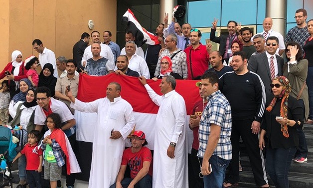 Egyptian community in Doha gathered outside a polling station after casting their vote on the second day of presidential election abroad - Egypt Today