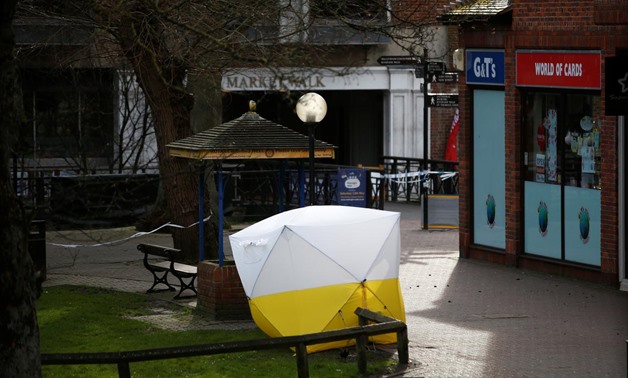 A tent covers the park bench where former Russian intelligence agent Sergei Skripal and his daughter Yulia were found after they were poisoned, in Salisbury, Britain. March 14, 2018. REUTERS/Henry Nicholls