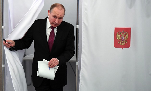 Russian President and Presidential candidate Vladimir Putin at a polling station during the presidential election in Moscow, Russia March 18, 2018. Yuri Kadobnov/POOL via Reuters