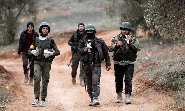 Sunday March 18, 2018. Turkish-backed Free Syrian Army fighters are seen near Mount Barsaya, northeast of Afrin