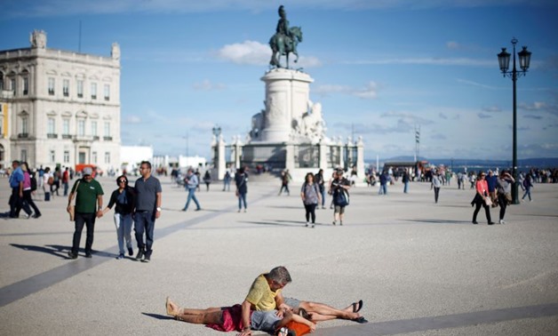 A couple of tourists rest at Comercio square in downtown Lisbon, Portugal April 29, 2017. — Reuters pix
