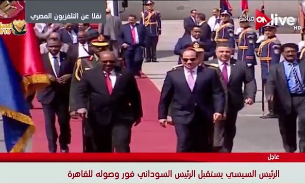 President Abdel Fatah al-Sisi received his Sudanese counterpart Omar al-Bashir on Monday at the Cairo International Airport- a screenshot from ON Live channel.