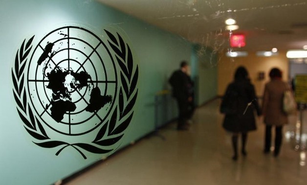 The United Nations logo is displayed on a door at U.N. headquarters in New York February 26, 2011 - REUTERS/ Joshua Lott
