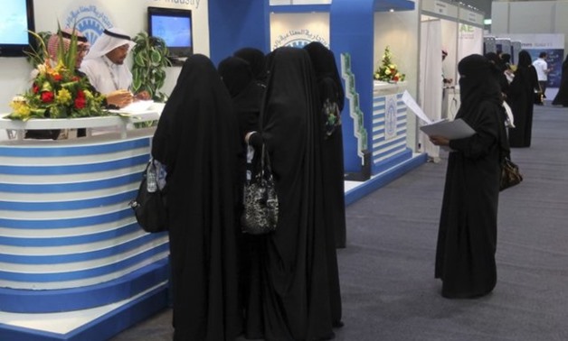 FILE PHOTO: Saudi Arabian women, seeking a job, talk with recruiters during a job fair in Riyadh January 25, 2012. REUTERS/ Stringer