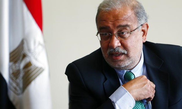 Egypt’s Prime Minister Sherif Ismail talks during an interview with Reuters on investments undertaken by his country, which is facing an energy crisis, at his office in Cairo September 22, 2014. REUTERS/Amr Abdallah Dalsh
