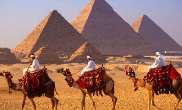 Camel riders near the Giza Pyramids - AFP