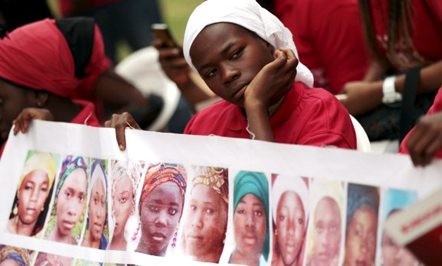 Bring Back Our Girls (BBOG) campaigners look on during a protest procession marking the 500th day since the abduction of girls in Chibok, along a road in Abuja on 27 August 2015. REUTERS/Afolabi Sotunde 

