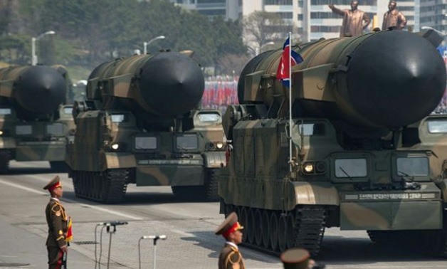 An unidentified rocket is displayed during a military parade - AFP/Ed JONES