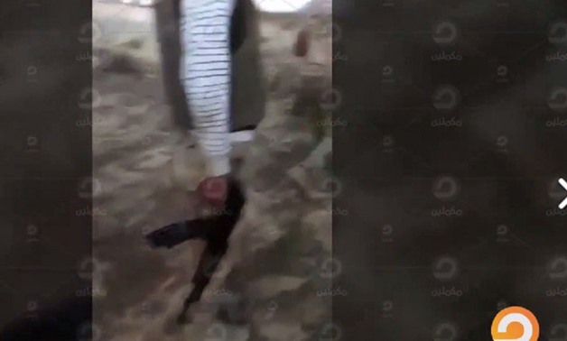 Frame of the video shows an armed man wearing civilian cloths