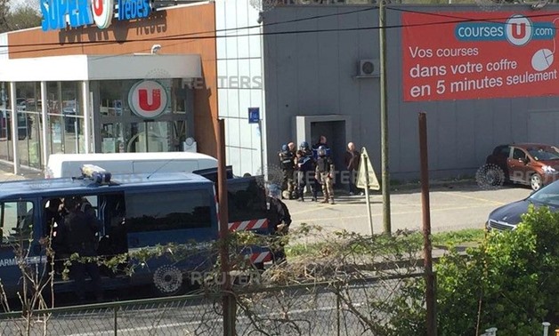 Police are seen at the scene of a hostage situation in a supermarket in Trebes, Aude, France March 23, 2018 in this picture obtained from a social media video. LA VIE A TREBES/via REUTERS