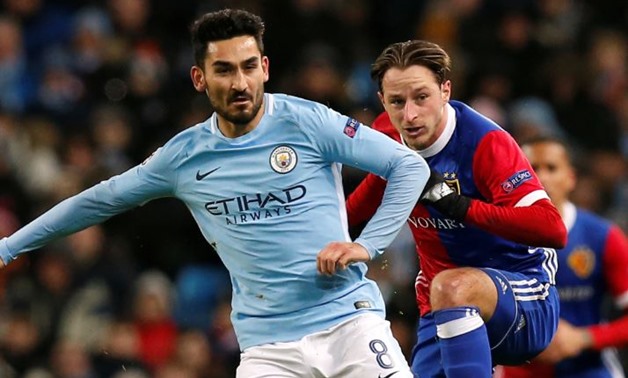 Soccer Football - Champions League Round of 16 Second Leg - Manchester City vs FC Basel - Etihad Stadium, Manchester, Britain - March 7, 2018 Manchester City's Ilkay Gundogan in action with Basel’s Luca Zuffi REUTERS/Andrew Yates
