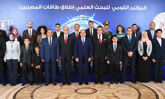 President Abdel Fatah al-Sisi among statesmen, scientists and researchers during the inauguration of the “National Conference for Scientific Research” on March 24, 2018 - Press Photo