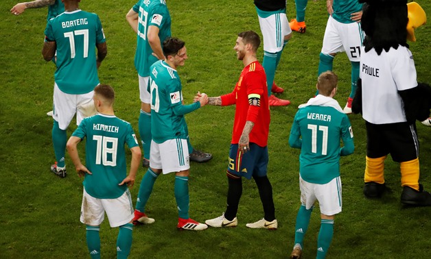 Soccer Football - International Friendly - Germany vs Spain - ESPRIT arena, Dusseldorf, Germany - March 23, 2018 Germany’s Mesut Ozil shakes hands with Spain’s Sergio Ramos after the match REUTERS/Wolfgang Rattay
