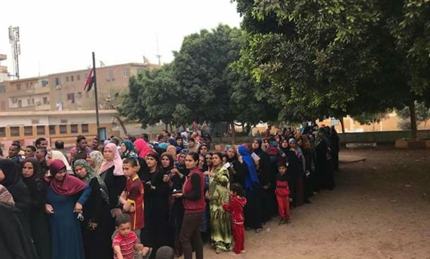 Voters line up outside Dayrut polling station in Asyut governorate - Egypt Today

