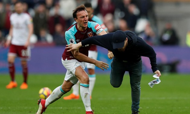 FILE PHOTO - Soccer Football - Premier League - West Ham United vs Burnley - London Stadium, London, Britain - March 10, 2018 West Ham United's Mark Noble clashes with a fan who has invaded the pitch Action Images via Reuters/Peter Cziborra
