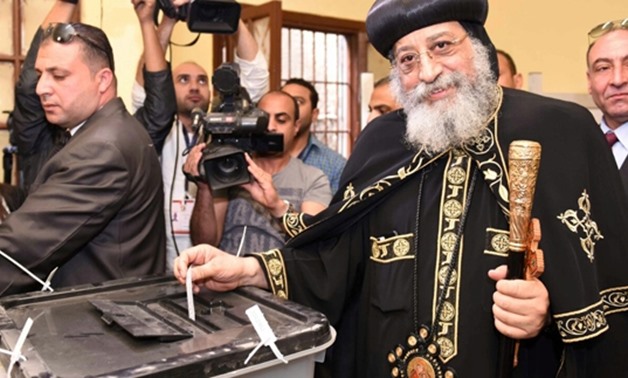 Pope Tawadros II casts his vote in a close school to the Cathedral of Abbasiya- Press photo
