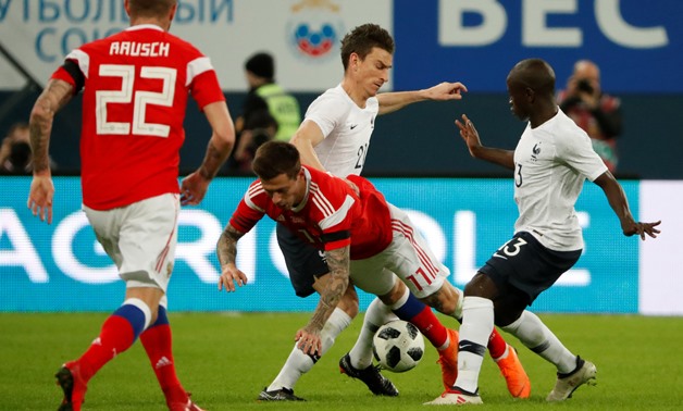Soccer Football - International Friendly - Russia vs France - Saint-Petersburg Stadium, Saint Petersburg, Russia - March 27, 2018 Russia’s Fedor Smolov in action with France’s N'Golo Kante and Laurent Koscielny REUTERS/Grigory Dukor
