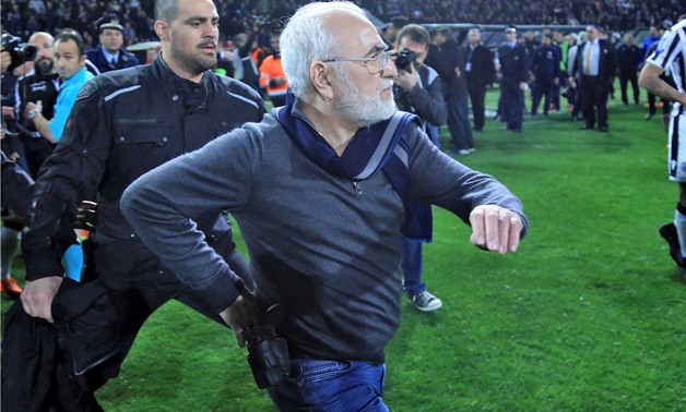 van Savvides, pictured with what appears to be a gun in a holster, enters the pitch after the referee annulled a goal of PAOK during their soccer match against AEK Athens in Toumba Stadium in Thessaloniki, Greece, March 11, 2018. Intimenews via REUTERS/Fi
