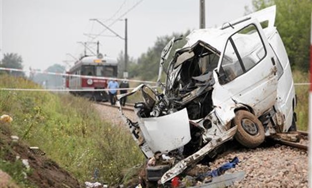 The wreck of a minibus is seen at a crash site in Bratoszewice near Lodz - Reuters 