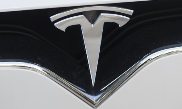 Tesla and other manufacturers are investing billions of dollars in the push to develop vehicles which, in the future, will not need any driver intervention - AFP
