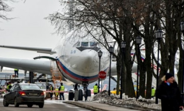 The plane carrying 46 Russian diplomats and their family members at Moscow's Vnukovo airport on Sunday - AFP