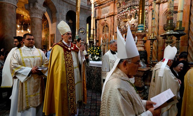 The head of the Roman Catholic Church in the Holy Land, Apostolic Administrator of the Latin Patriarchate Pierbattista Pizaballa leads the Easter Sunday procession on April 1, 2018 at the Church of the Holy Sepulchre, traditionally believed to be the site