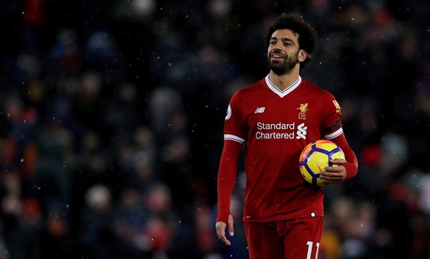 March 17, 2018 Liverpool's Mohamed Salah celebrates with the match ball after a game Action Images via Reuters/Lee Smith/Files 