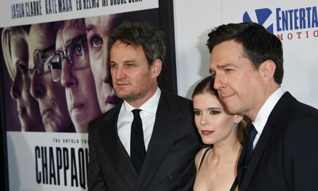 Actors (L-R) Jason Clarke, Kate Mara and Ed Helms arrive on the red carpet for the premiere of "Chappaquiddick" in Beverly Hills, California