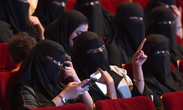 This photo taken on October 20, 2017 shows Saudi women attending the "Short Film Competition 2" festival at King Fahad Culture Centre in Riyadh. Saudi Arabia on Monday announced a lifting of the kingdom's decades-long ban on cinemas. Fayez Nureldine / AFP